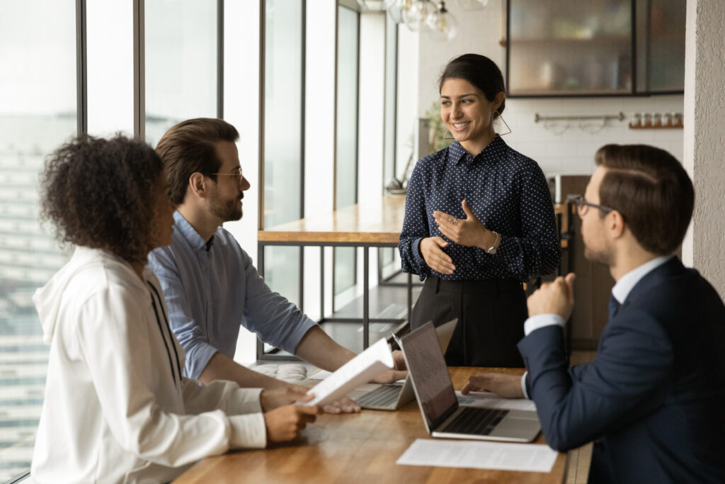 Smiling woman leading corporate meeting