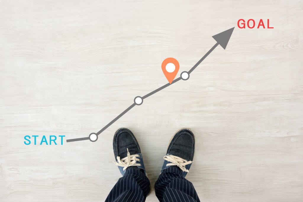 Casual man's feet and route with a start and a goal