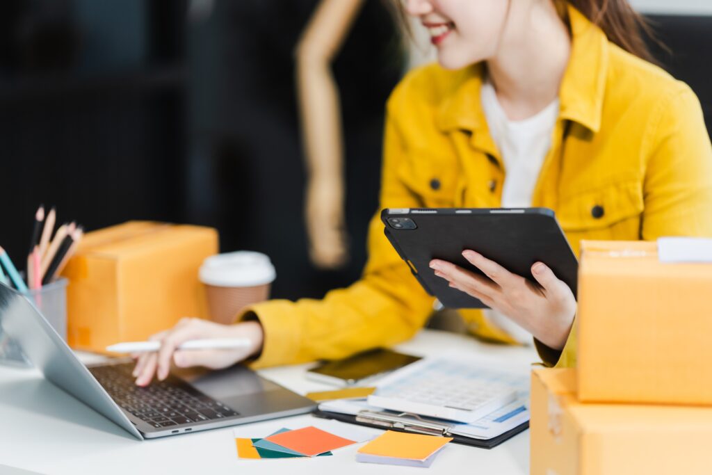 young woman using her laptop for her outreach strategies