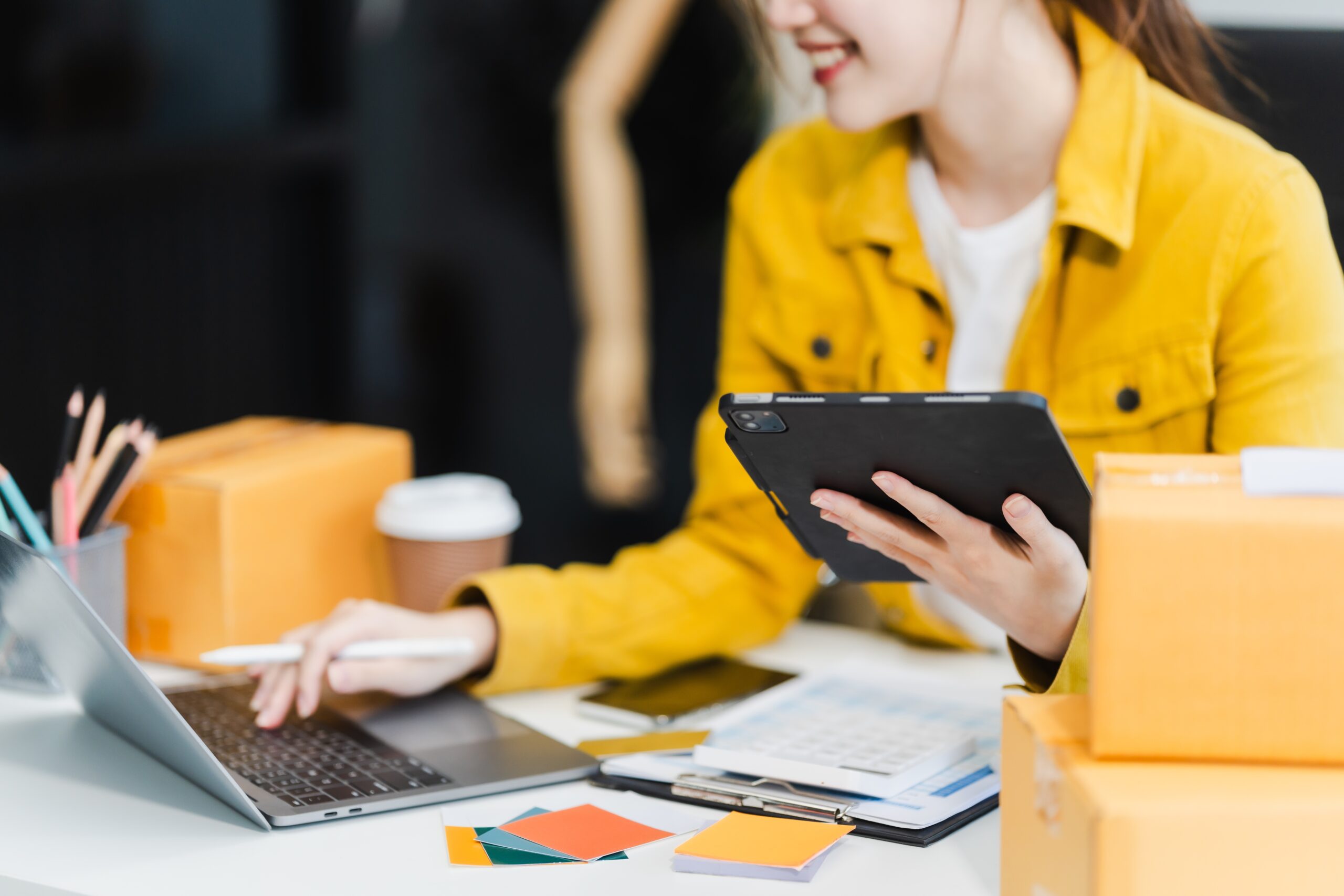 young woman using her laptop for her outreach strategies